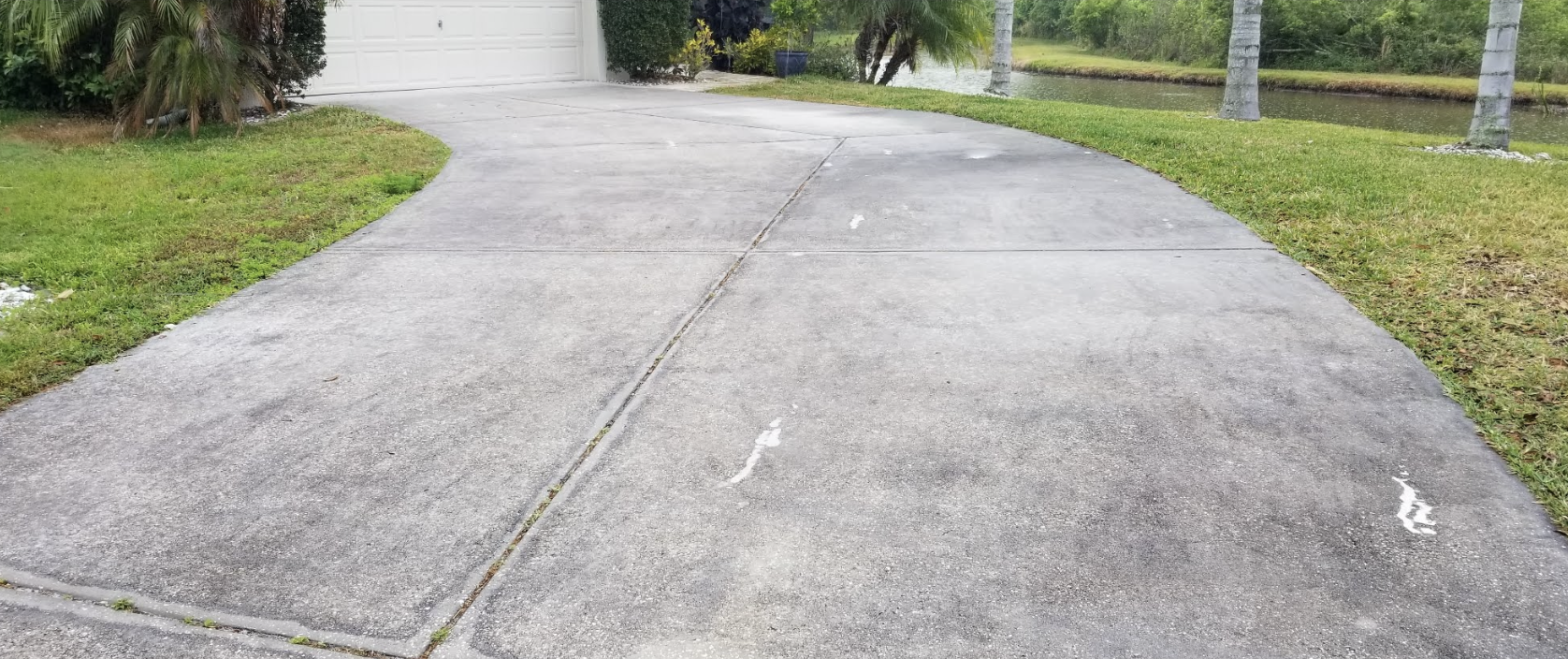 Before and after Driveway and Concrete Cleaning